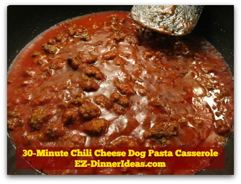 30-Minute Chili Cheese Dog Pasta Casserole - Stir in tomato sauce