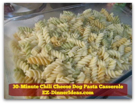 30-Minute Chili Cheese Dog Pasta Casserole - Transfer cooked pasta into a casserole dish