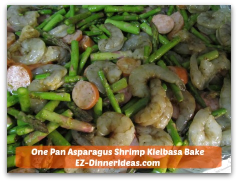 One Pan Asparagus Shrimp Kielbasa Bake - Transfer everything to an aluminum foil-lined baking sheet.  Dinner will be ready in 30 minutes. One Pan Asparagus Shrimp Kielbasa Bake - Transfer everything to an aluminum foil-lined baking sheet.  Dinner will be ready in 30 minutes.