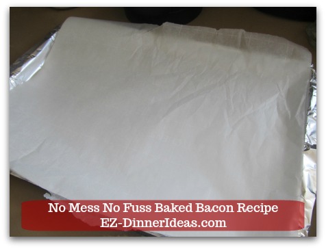 Oven Baked Bacon Recipe - Add a piece of parchment paper on top.