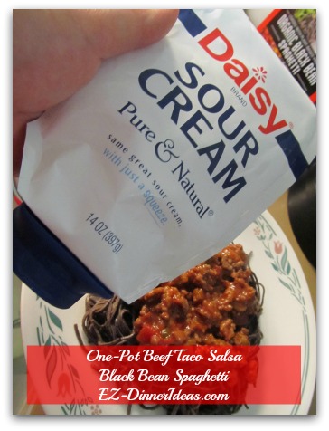 One-Pot Beef Taco Salsa Black Bean Spaghetti - Use squeezable sour cream to make a distorted mummy face