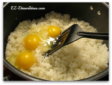 Eggs added on top of the hot rice to make best fried rice dishes Eggs added on top of the hot rice to make best fried rice dishes