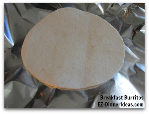 Breakfast Planning | Breakfast Burritos - Lay a piece of aluminum foil which is slightly bigger than the tortilla on a flat surface Breakfast Planning | Breakfast Burritos - Lay a piece of aluminum foil which is slightly bigger than the tortilla on a flat surface