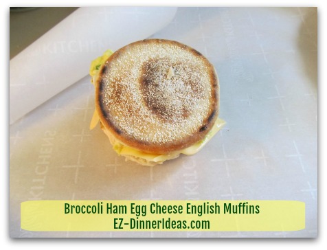 Broccoli Ham Egg Cheese English Muffins - Wrap each sandwich individually with parchment paper - step 1 Broccoli Ham Egg Cheese English Muffins - Wrap each sandwich individually with parchment paper - step 1