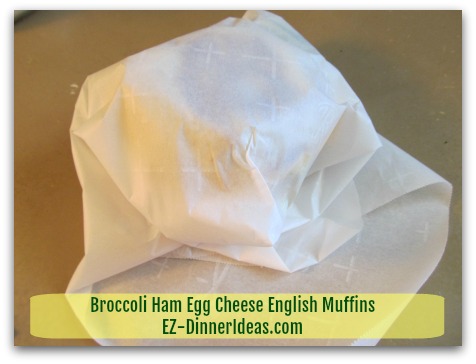 Broccoli Ham Egg Cheese English Muffins - Wrap each sandwich individually with parchment paper - step 2 Broccoli Ham Egg Cheese English Muffins - Wrap each sandwich individually with parchment paper - step 2