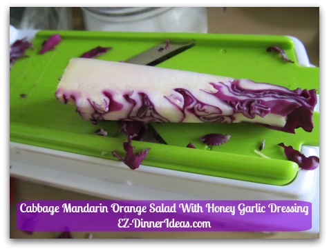 Cabbage Mandarin Orange Salad With Honey Garlic Dressing - The cabbage core is your handle.  Once its job is done, discard it