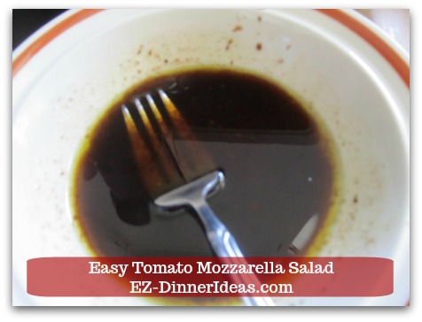 Caprese Salad Recipe | Easy Tomato Mozzarella Salad - Whisk in extra virgin olive oil to make vinaigrette.