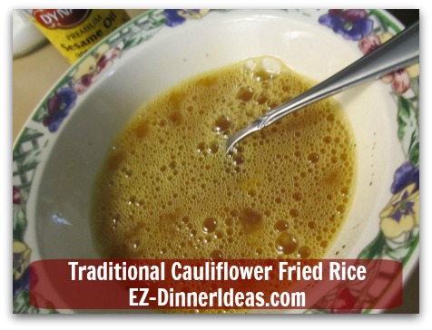 Traditional Cauliflower Fried Rice - Beat eggs with soy sauces, salt and pepper in a mixing bowl