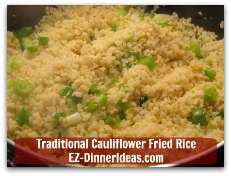 Traditional Cauliflower Fried Rice - Garnish with scallion; salt and pepper to taste and serve immediately