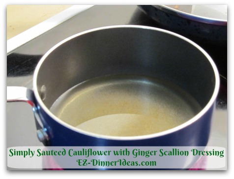Simply Sauteed Cauliflower with Ginger Scallion Dressing - Heat 1 cup Canola Oil at high heat until it bubbles