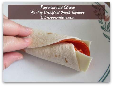 Pepperoni and Cheese No-Fry Breakfast Snack Taquitos - Hold it tight for a few seconds to keep it unroll on you Pepperoni and Cheese No-Fry Breakfast Snack Taquitos - Hold it tight for a few seconds to keep it unroll on you