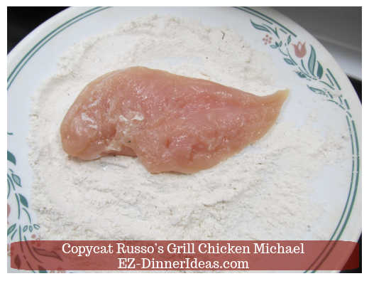 Dredging chicken in flour mixture Dredging chicken in flour mixture