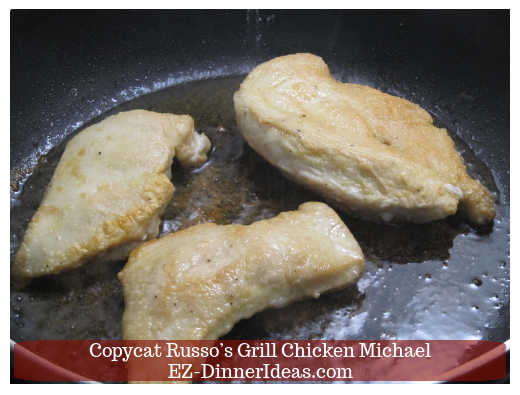 Cooking chicken into a skillet Cooking chicken into a skillet