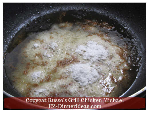 Adding flour into the grease to make roux Adding flour into the grease to make roux