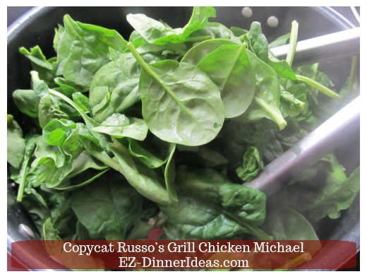 Adding fresh spinach into broccoli Adding fresh spinach into broccoli