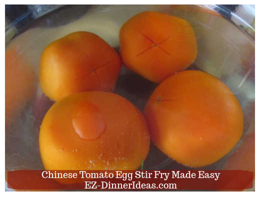 Tomatoes submerging into hot water Tomatoes submerging into hot water