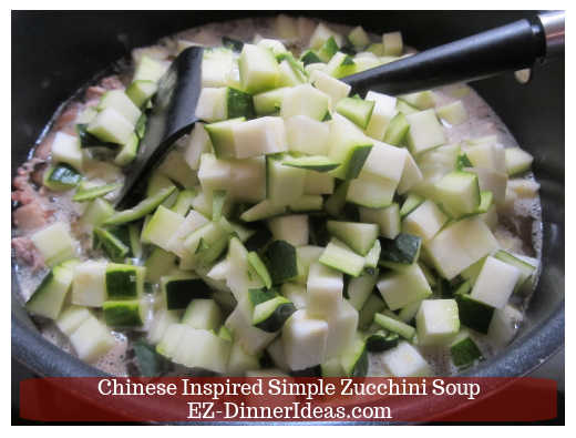 Adding zucchini into the soup