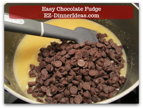 Easy Chocolate Fudge - Stir in chocolate, nuts (optional) and vanilla extract.