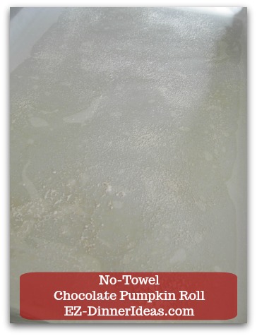 Chocolate Cake Roll | No-Towel Chocolate Pumpkin Roll - Line a half-sheet baking sheet with wax paper dusted with flour.