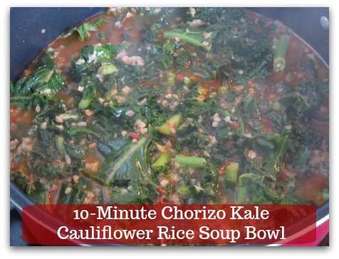 Sausage Kale Soup Recipe | 10-Minute Chorizo Kale Cauliflower Rice Soup Bowl - Add kale into the soup.  Use a spatula to press the vegetables down into the soup.