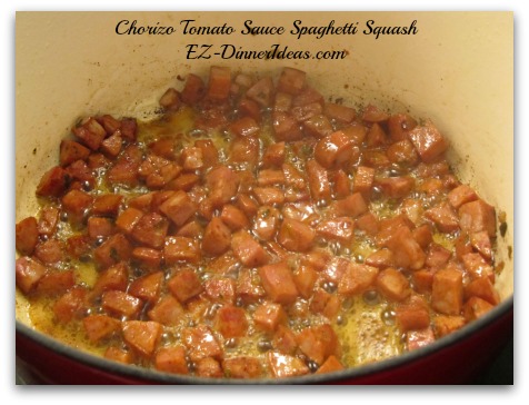 Add Chorizo sausage into the oil mixture and brown for about 5 minutes, stir regularly