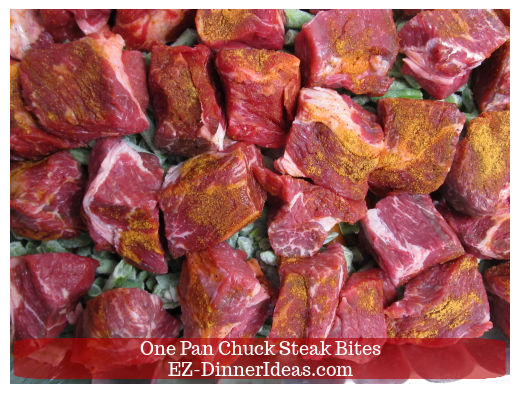 Seasoned chuck steak bites on top of vegetables Seasoned chuck steak bites on top of vegetables