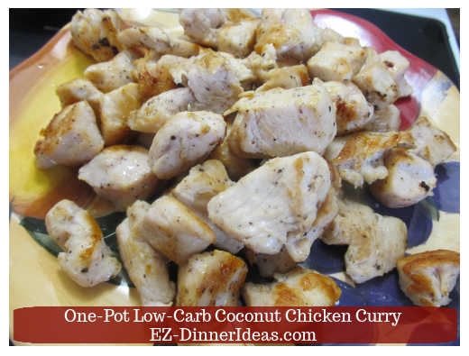 Chicken transferred to a plate after browning