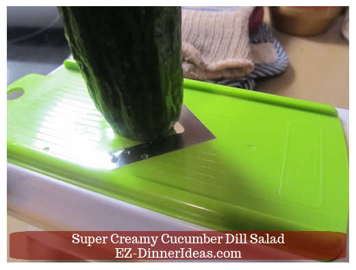 Slicing cucumber with mandoline Slicing cucumber with mandoline