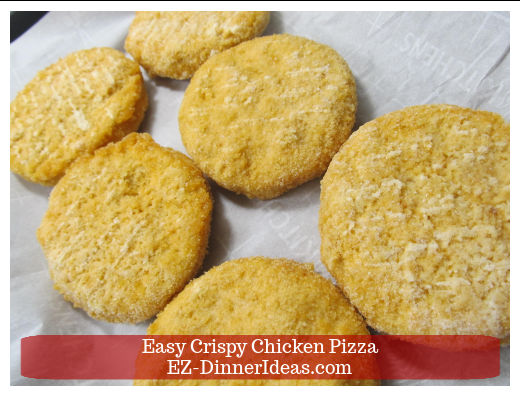Frozen chicken patties on baking sheet