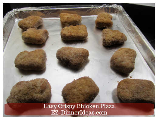 Chicken nuggets on baking sheet Chicken nuggets on baking sheet