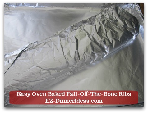 Baby Back Pork Ribs Recipe | Easy Oven Baked Fall-Off-The-Bone Ribs - Transfer the foil covered baby back ribs to the baking sheet and meat side up.