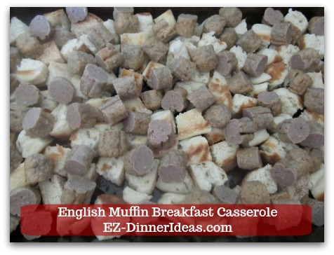 English Muffin Breakfast Casserole - Evenly spread sausage on top of muffin pieces.