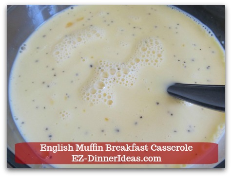English Muffin Breakfast Casserole - Whisk to combine egg mixture.