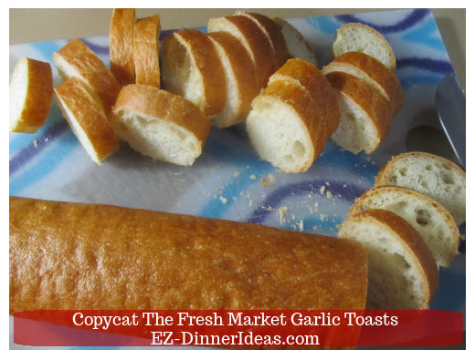 Cutting baguette into slices Cutting baguette into slices