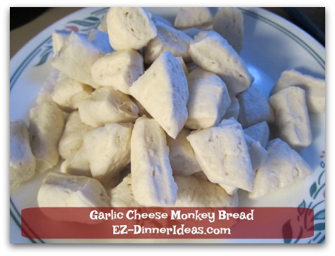 Garlic Cheese Monkey Bread - Cut each slice of store bought biscuit dough into 4-6 small pieces