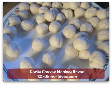 Garlic Cheese Monkey Bread - Roll each dough into a ball.  This allows the coating and cheese cover every piece evenly