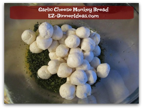 Garlic Cheese Monkey Bread - Add biscuit dough into the seasoning paste and toss to coat with hands