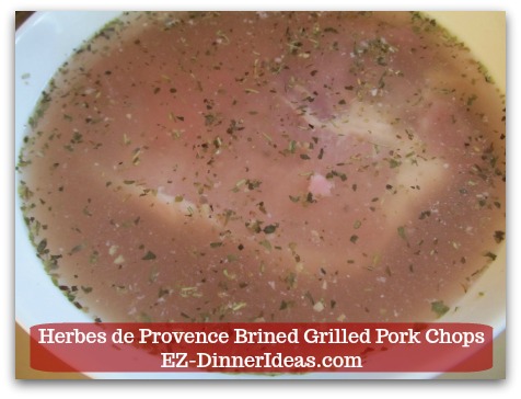 Herbes de Provence Brined Grilled Pork Chops - Make sure all meat is submerged in the brine