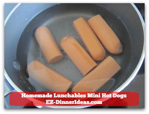 Homemade Lunchables Mini Hot Dogs - In a saucepan with water Homemade Lunchables Mini Hot Dogs - In a saucepan with water