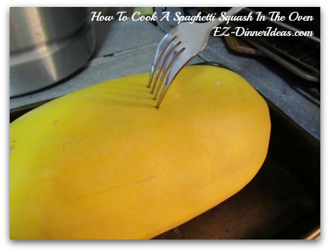 Use a fork to poke several times on the spaghetti squash to let the steam out