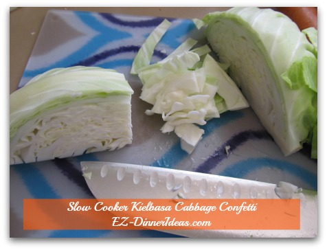 Cabbage Dinner Recipe | Slow Cooker Kielbasa Cabbage Confetti - Core is out.  Turn cabbage 90 degrees.  Cut side faces yourself  to cut against the leaves.