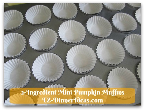 Recipe Using Spice Cake Mix | 2-Ingredient Mini Pumpkin Muffins - Line mini cupcake liners in cupcake tin