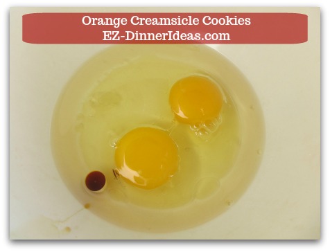 Easy Cake Mix Cookies Recipe | Orange Creamsicle Cookies - Beat 2 eggs, 1/3 cup canola oil and vanilla extract (if you use yellow cake mix) together.