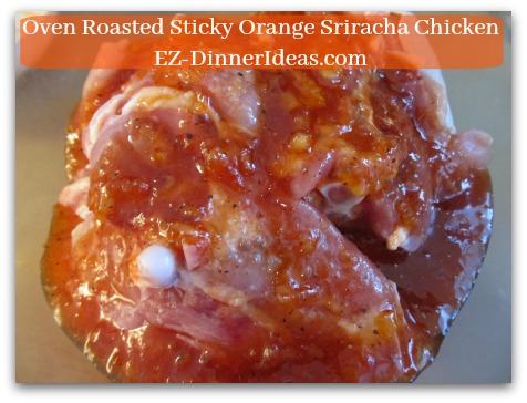 Oven Roasted Sticky Orange Sriracha Chicken - Toss to coat chicken with marinade