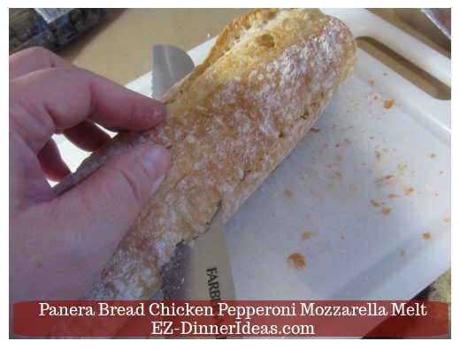 Cutting baguette into halves lengthwise