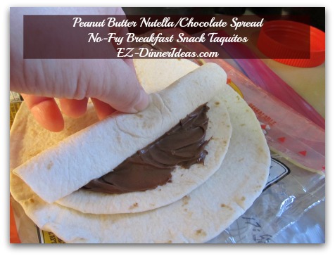 Peanut Butter Nutella/Chocolate Spread No-Fry Breakfast Snack Taquitos - As you roll it towards the other end, you will know why you need to leave the edges not covered with spread Peanut Butter Nutella/Chocolate Spread No-Fry Breakfast Snack Taquitos - As you roll it towards the other end, you will know why you need to leave the edges not covered with spread