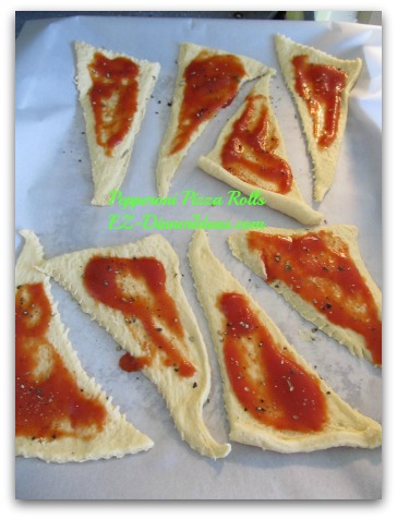 Pepperoni Pizza Rolls - Unroll dough and put tomato sauce, Parmesan cheese, black pepper and oregano on top Pepperoni Pizza Rolls - Unroll dough and put tomato sauce, Parmesan cheese, black pepper and oregano on top