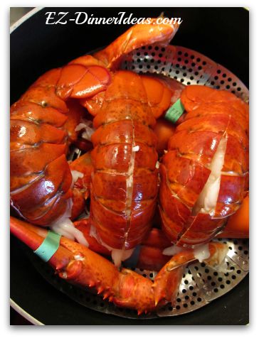 After separating the heads, tails and claws, line up the lobsters on the steamer