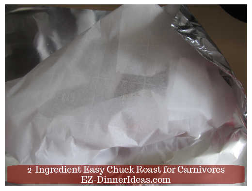 Chuck roast wrapped under parchment paper