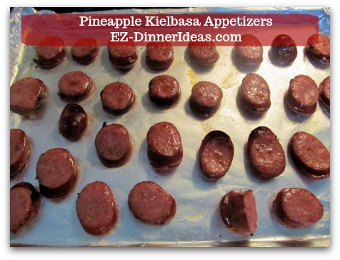 Kielbasa Appetizers | Pineapple Kielbasa - Single layer sliced Kielbasa on a baking sheet with about 1/4” space around. Kielbasa Appetizers | Pineapple Kielbasa - Single layer sliced Kielbasa on a baking sheet with about 1/4” space around.